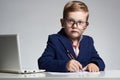 Business boy. funny child in glasses writing pen. little boss in office Royalty Free Stock Photo