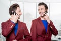 Business brothers twins with phones Royalty Free Stock Photo