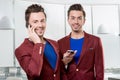 Business brothers twins with phones Royalty Free Stock Photo