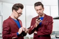 Business brothers twins with phones Royalty Free Stock Photo