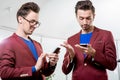 Business brothers twins with phones Royalty Free Stock Photo