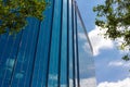 Business building reflecting clouds and blue sky Royalty Free Stock Photo