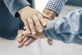 Business, building, partnership, gesture , stacking hands express their teamwork and cooperation Royalty Free Stock Photo