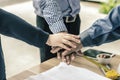 Business, building, partnership, gesture , stacking hands express their teamwork and cooperation Royalty Free Stock Photo