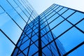 Business Building with Glass Windows Reflecting Blue Sky Royalty Free Stock Photo