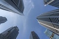 Business buildings skyline looking up with blue sky background. High-rise skyscraper, modern architecture Royalty Free Stock Photo