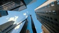 Business buildings skyline looking up with blue sky background. High-rise skyscraper, modern architecture Royalty Free Stock Photo