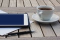 Business, calendars, appointment. Office table with notepad, computer, coffee cup.