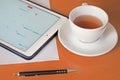 Business, calendars, appointment. Office table with notepad, computer, coffee cup. Royalty Free Stock Photo