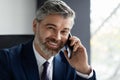 Business Call. Closeup Shot Of Smiling Mature Businessman Talking On Cellphone Royalty Free Stock Photo