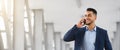 Business Call. Handsome Young Arab Man Talking On Mobile Phone Royalty Free Stock Photo