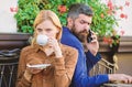 Business call white dating. First meet of girl and mature man. Brutal bearded hipster and girl drink coffee. Couple in