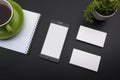 Business card blank, smartphone or tablet pc, flower and pen at office desk table top view. Corporate stationery Royalty Free Stock Photo