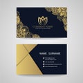 Business card - gold floral frame and lotus logo and gold paper on dark blue background