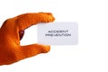 Business card in hand in orange glove