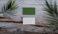 Business card mock up on old wood with leaf, nature mock up concept Royalty Free Stock Photo