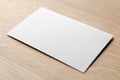 Business card mockup on a oak wood table, 85x55 mm Royalty Free Stock Photo