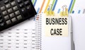 BUSINESS CASE text, written on a sticker with calculator,pen on the chart background Royalty Free Stock Photo