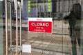 Business center closed due to COVID-19, sign with sorry in door window. Stores, restaurants, offices, other public places