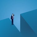 Business Challenge Concept. Businessman Confuse at The Edge of a Gap Royalty Free Stock Photo
