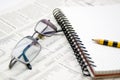 Business chart. Newspaper,pad and eyeglasses Royalty Free Stock Photo