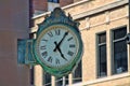 Business Clock Mounted On The Side Of A Building