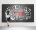Business coach, white and red plan, blackboard Royalty Free Stock Photo