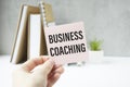 Business Coaching Text on paper. Business