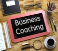 Business Coaching - Text on Small Chalkboard. 3D. Royalty Free Stock Photo