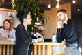 Business coleagues having a chat at a cafe bar