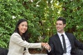 Business Collaboration. Young businessmen shake hands When the news is good. Royalty Free Stock Photo