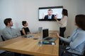 Business colleagues attending a video call in conference room Royalty Free Stock Photo