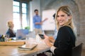 Business colleagues in conference meeting room during presentation. Businesswoman using digital tablet Royalty Free Stock Photo