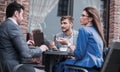 Business colleagues discussing business issues at the coffee table Royalty Free Stock Photo