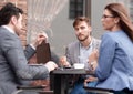 Business colleagues discussing business issues at the coffee table Royalty Free Stock Photo