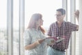 Business colleagues discussing over file in creative office Royalty Free Stock Photo