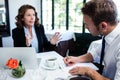 Business colleagues discussing and taking notes while having a meeting Royalty Free Stock Photo