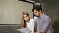 Business colleagues doing paperwork together at the office