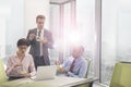 Business colleagues eating lunch in boardroom during meeting at office Royalty Free Stock Photo