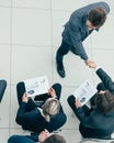 Business colleagues greeting each other at a business meeting.