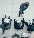 business colleagues greeting each other at a business meeting.