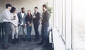 Business colleagues having coffee break near window Royalty Free Stock Photo