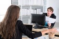 Business colleagues having meeting in the home office, or two young coworkers working on laptop computer at modern office Royalty Free Stock Photo