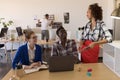 Business colleagues interacting with each other in office Royalty Free Stock Photo