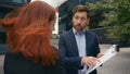 Business colleagues man and woman arguing disagreeing bad business contract in city partners having conflict dispute Royalty Free Stock Photo