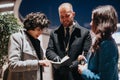 Business colleagues sharing ideas outdoor meeting at night. Royalty Free Stock Photo