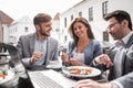 Business colleagues sitting at a table in a cafe Royalty Free Stock Photo