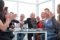 Business colleagues sitting at a table during a meeting with two Royalty Free Stock Photo