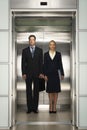 Business Colleagues Standing Together In Elevator Royalty Free Stock Photo