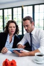 Business colleagues using a digital tablet while having a meeting Royalty Free Stock Photo